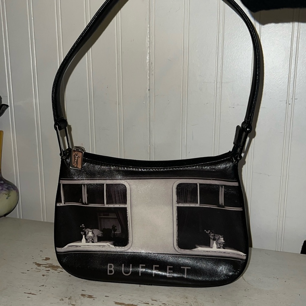 Icon double sided image of Buffet leather handbag. L:9x H: 6x W: 1.5